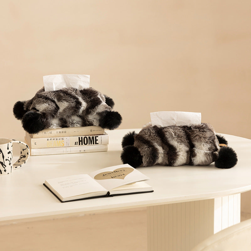 Cozy tissue box cover made of artificial fur with pom-pom application