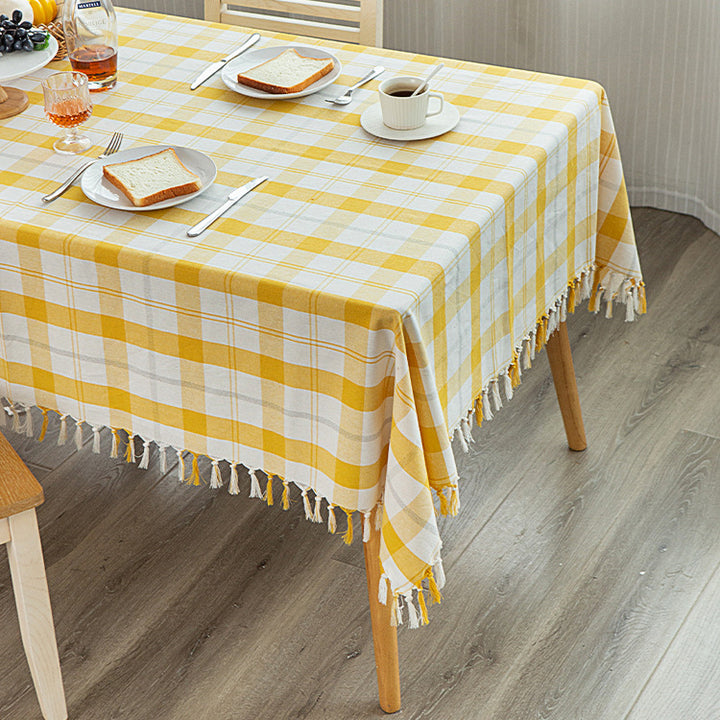 Rectangular checked cotton tablecloth with decorative fringes and light linen finish