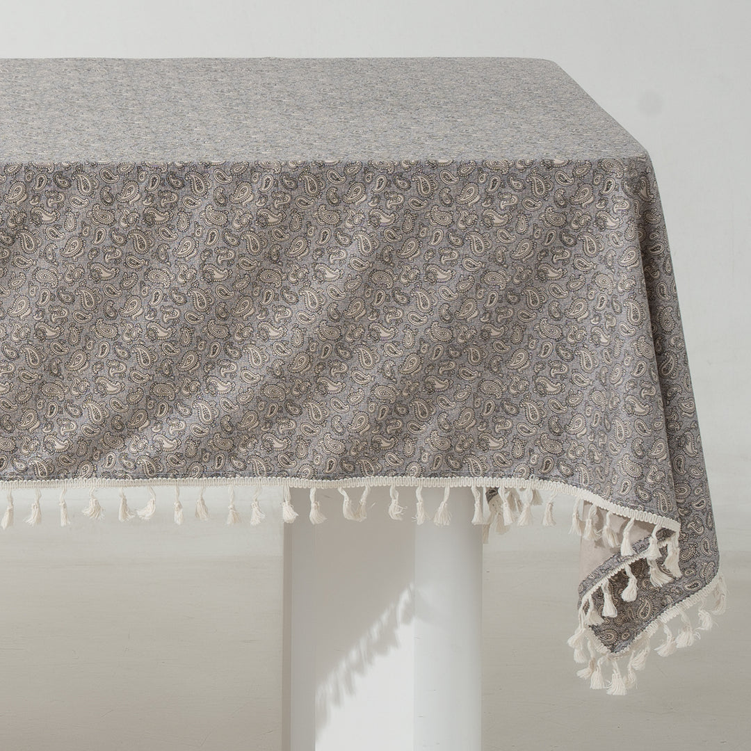Rectangular tablecloth with floral Millefleurs print and cotton tassels