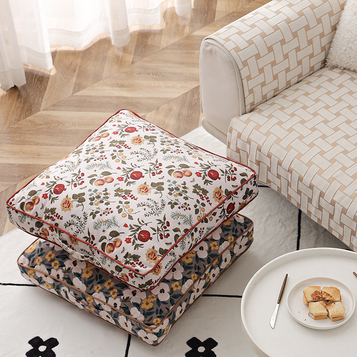 Large square floor cushion with floral cotton cover, piping, and carrying handle