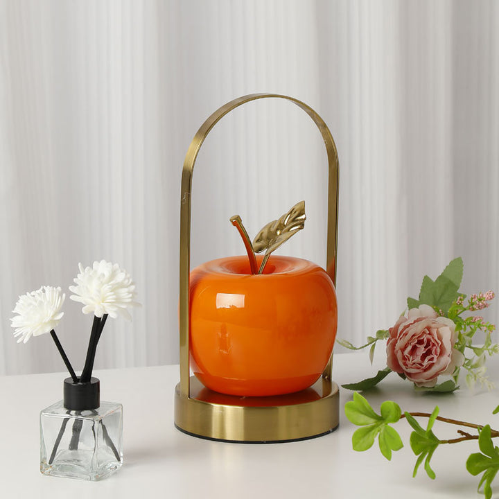 Ceramic apple-shaped ambient table lamp with brass handle