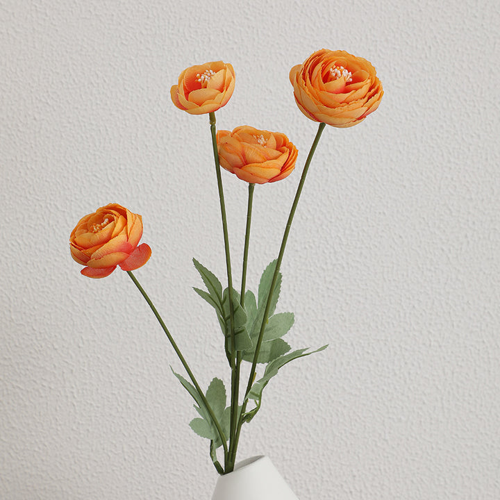Decorative artificial flower bouquet with intricately detailed ranunculus