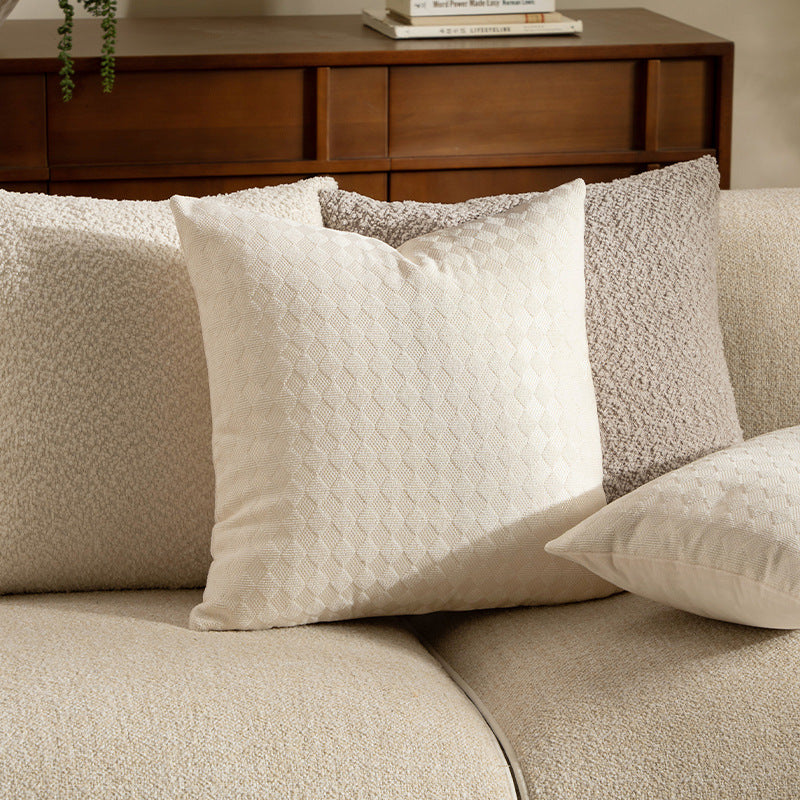 Woven decorative cushion cover with textured diamond relief surface