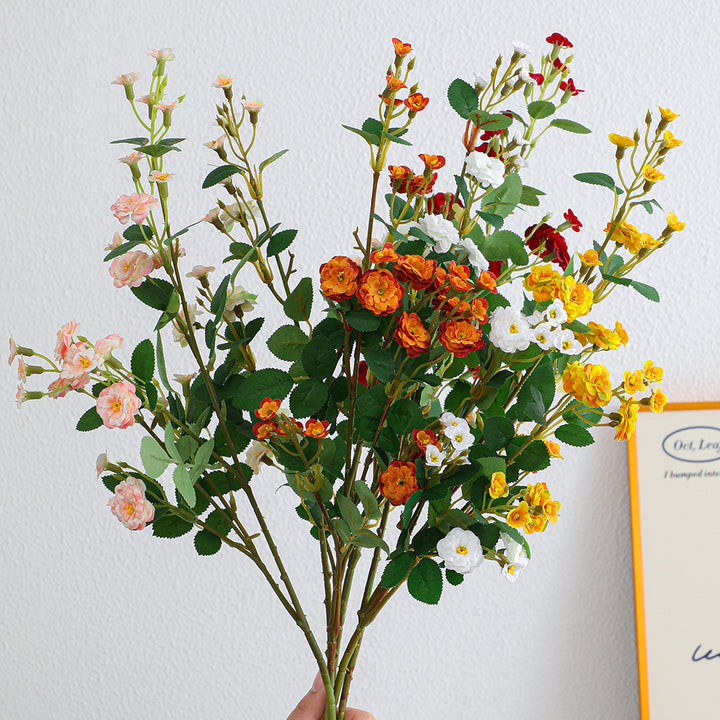 Artificial branch with decorative flowers