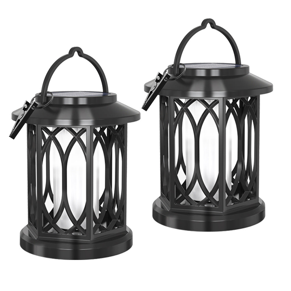 Decorative solar-powered hanging lantern for outdoor use with iron mesh frame
