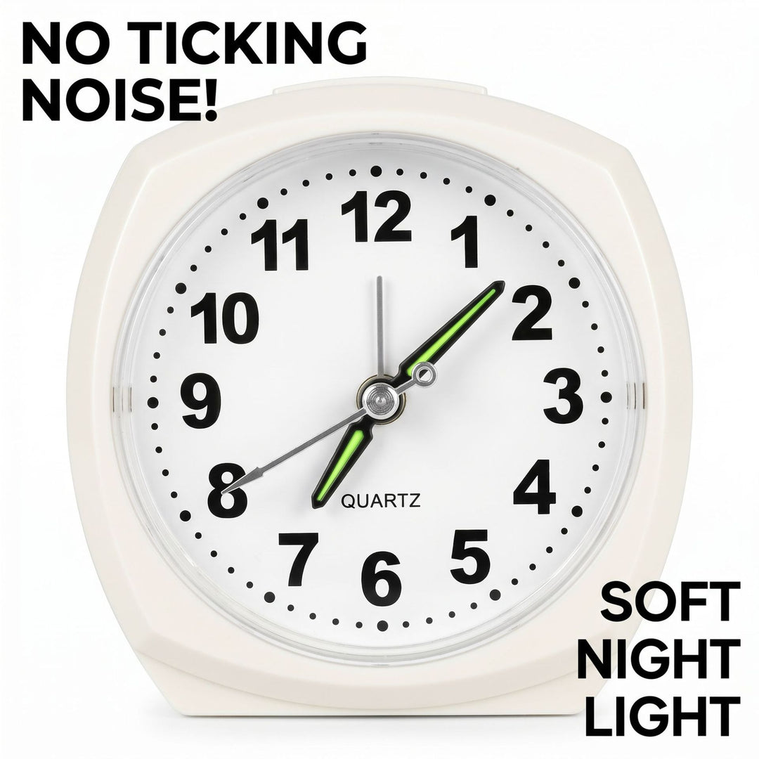 Analog alarm clock with night light and snooze function