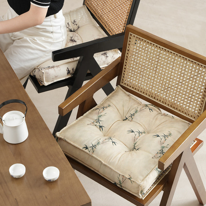 Padded square seat cushion with tufted stitching and fine bamboo print