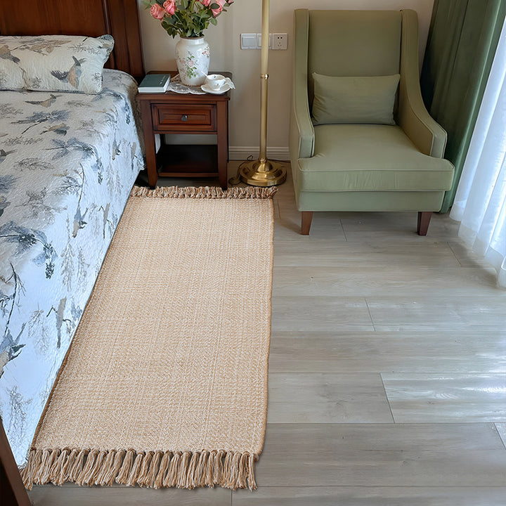 Woven table runner with dense herringbone jacquard and fringes