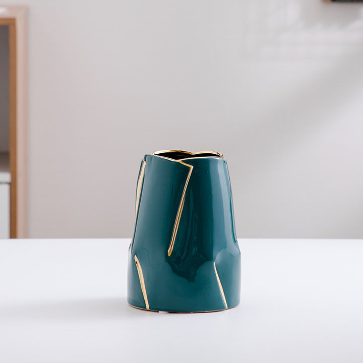 Decorative ceramic vase with golden accents