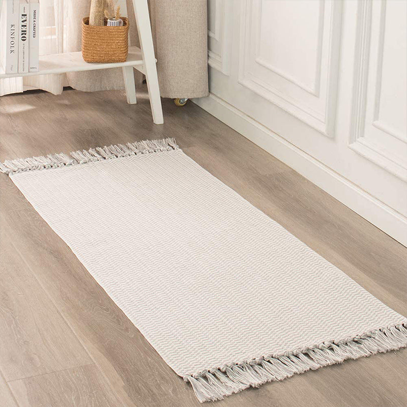 Flat-woven cotton rug runner with geometric check pattern and easy-care surface