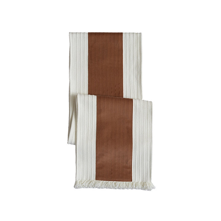 Woven table runner with contrasting center stripe, textured waffle look and decorative fringes