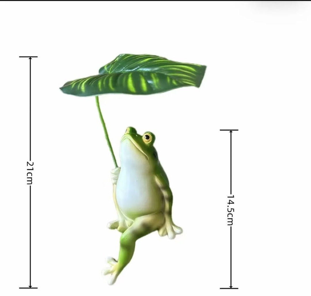 Funny frog figure with umbrella