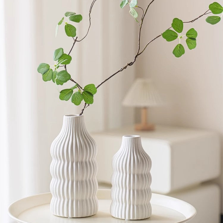 Stylish ceramic vase with wave structure