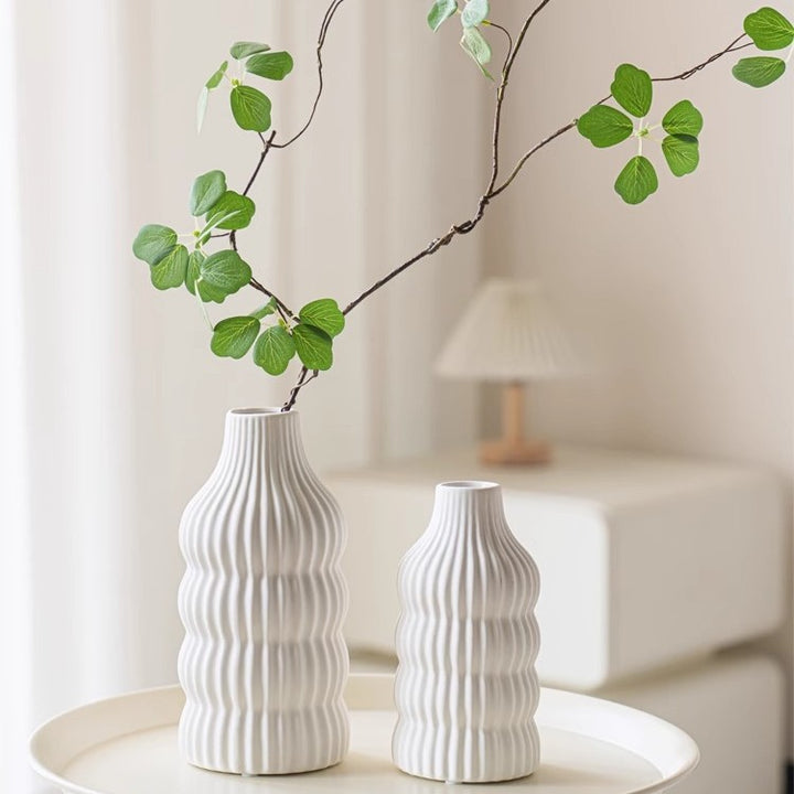 Stylish ceramic vase with wave structure