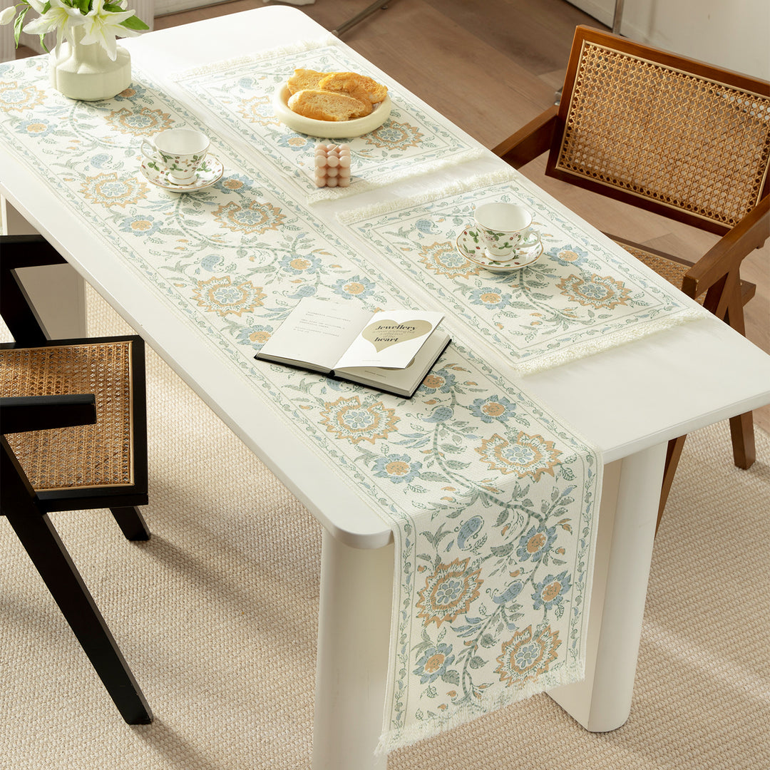 Round handmade woven decorative rug with fringes and botanical pattern