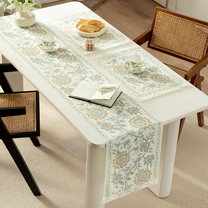 Round handmade woven decorative rug with fringes and botanical pattern