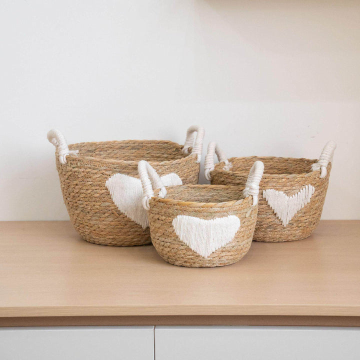 Handwoven storage basket with heart design