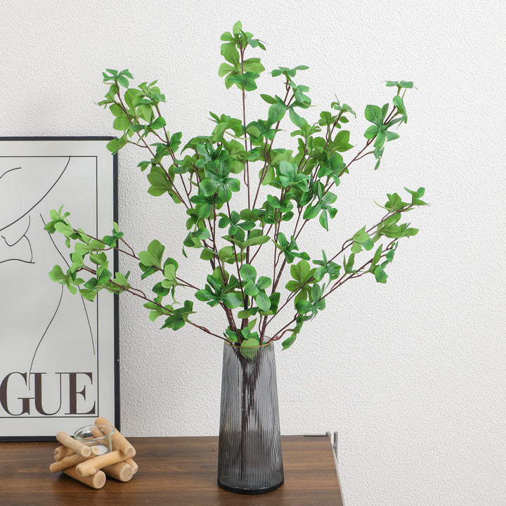 Decorative artificial branch with vibrant leaves