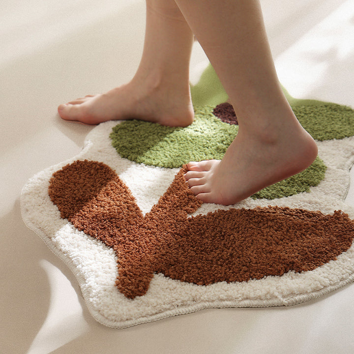 Flower-shaped hand-tufted bath mat with voluminous pile and non-slip latex backing