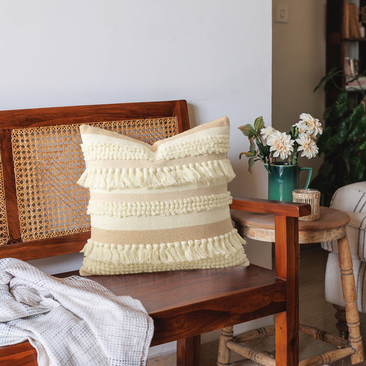 Decorative woven cushion cover with fringes and textured striped design