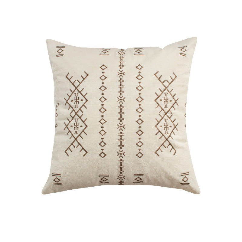 Square decorative cushion with fine relief embroidery in ethnic design and removable cover