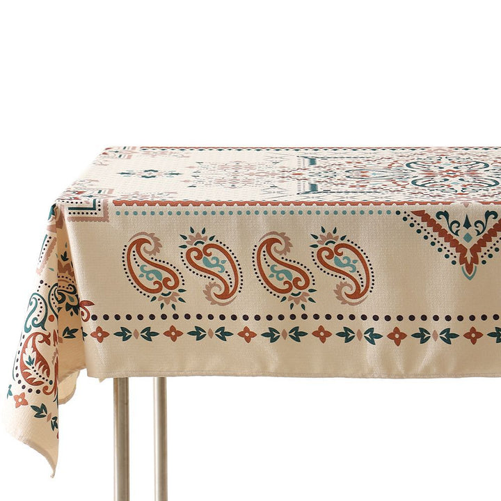 Water-repellent rectangular tablecloth with paisley pattern and coated cotton look