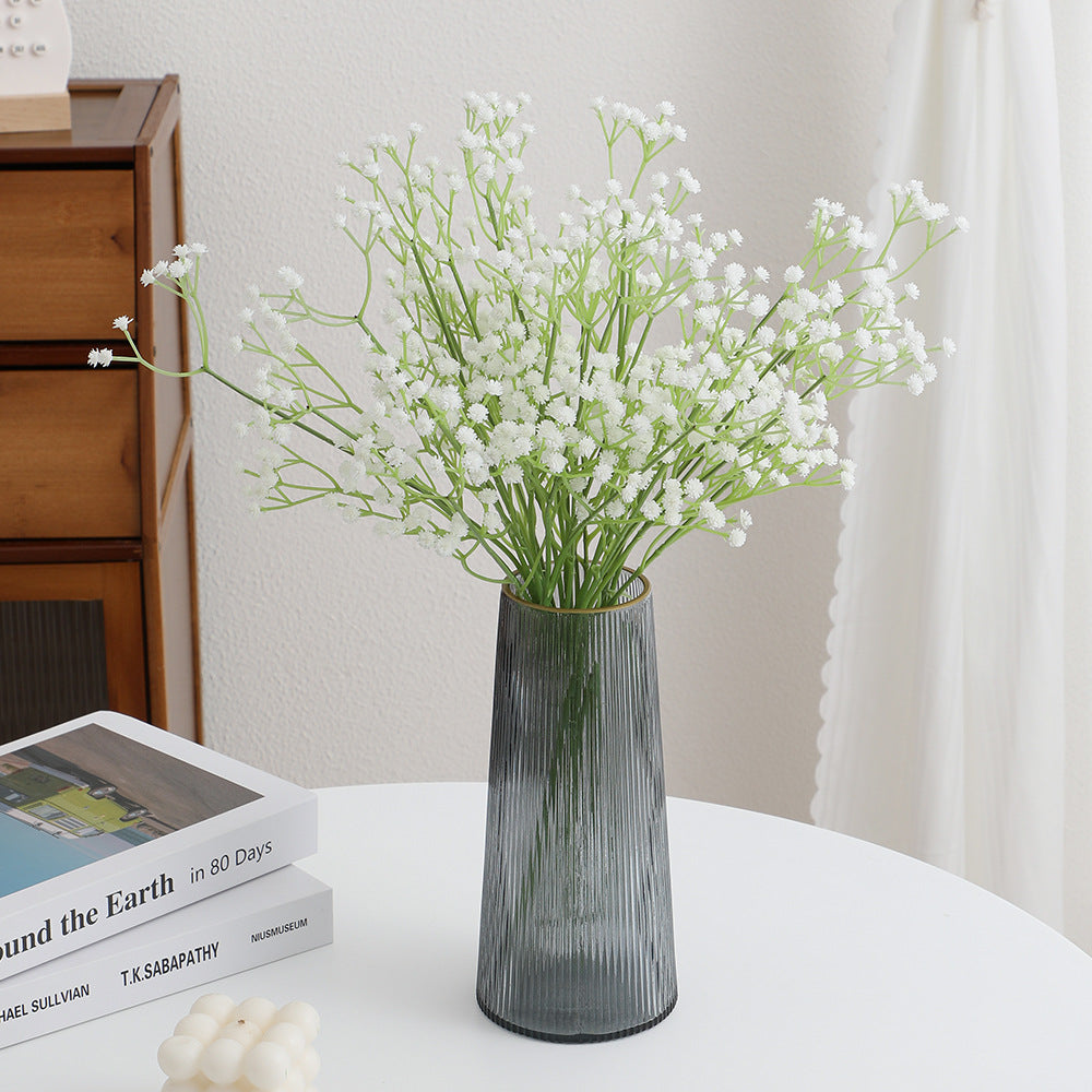 Decorative artificial flower branch with fine purple flowers