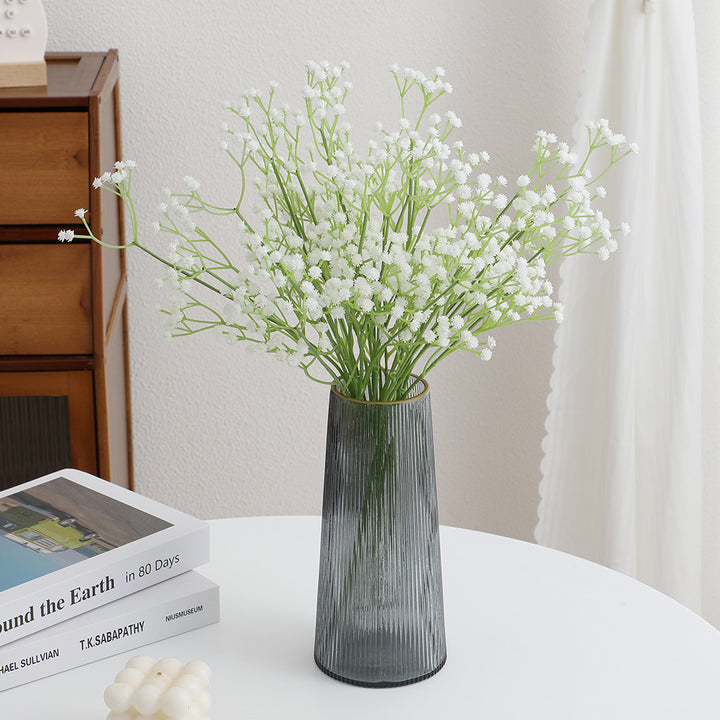 Decorative artificial flower branch with fine purple flowers