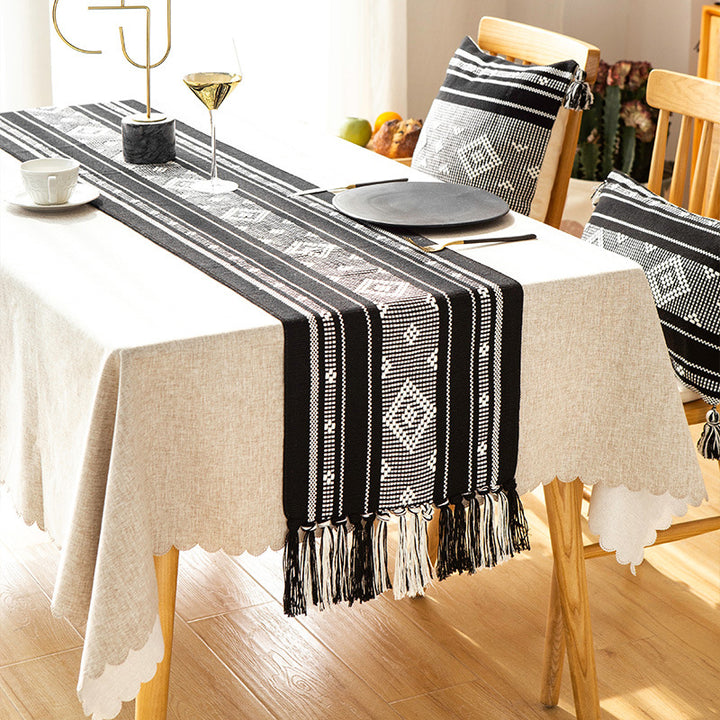 Handwoven table runner made of cotton blend with fringes and geometric dot jacquard