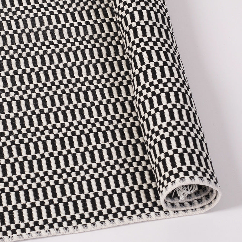 Flat-woven cotton rug runner with geometric check pattern and easy-care surface