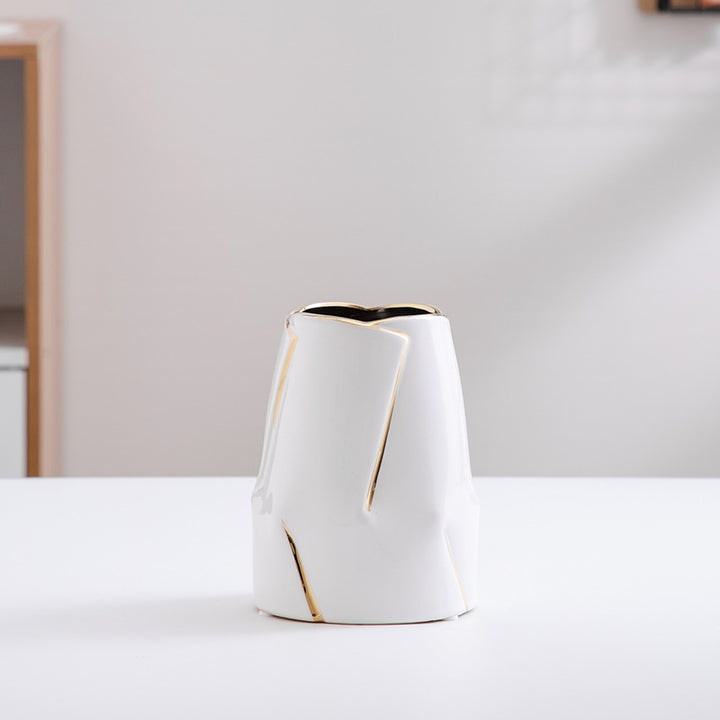 Decorative ceramic vase with golden accents
