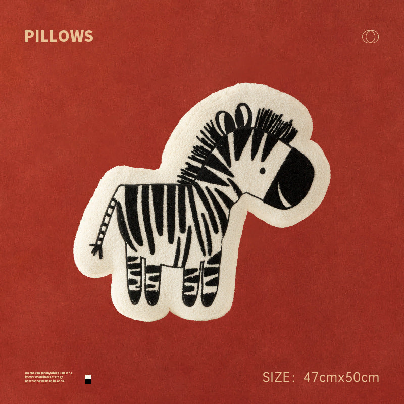 Shaped children's room decorative pillow made of teddy fleece with embroidered zebra motif and contoured silhouette