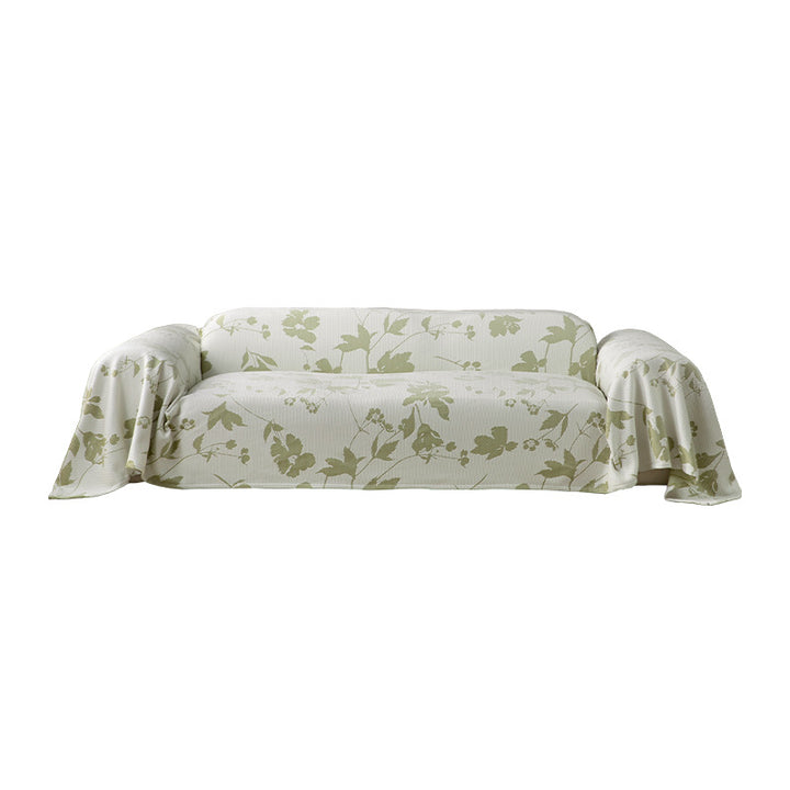 Universal sofa cover with floral relief and elastic hem