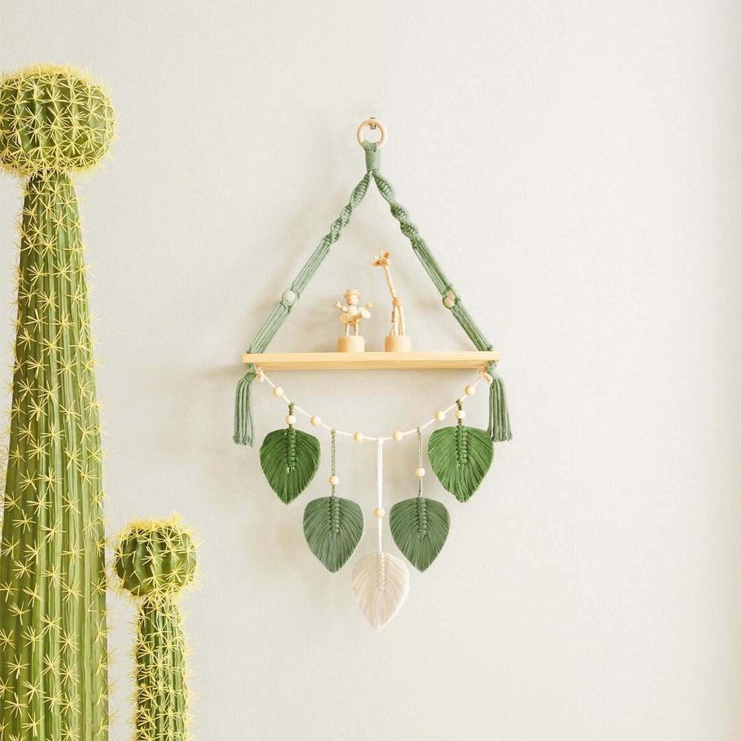 Macramé plant shelf with artistic leaf design