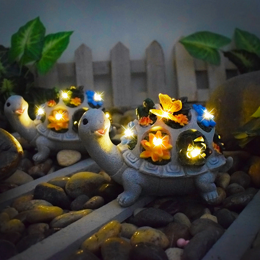 Solar-powered garden gnome sculpture with integrated LED fairy lights and turtle pot