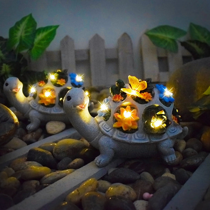 Solar-powered garden gnome sculpture with integrated LED fairy lights and turtle pot