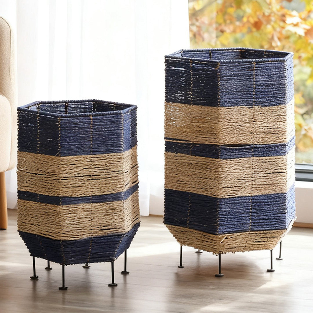 Stylish laundry basket made of rattan with metal legs