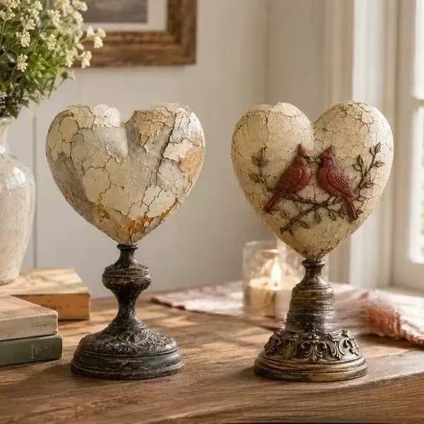 Decorative heart sculpture with bird motif