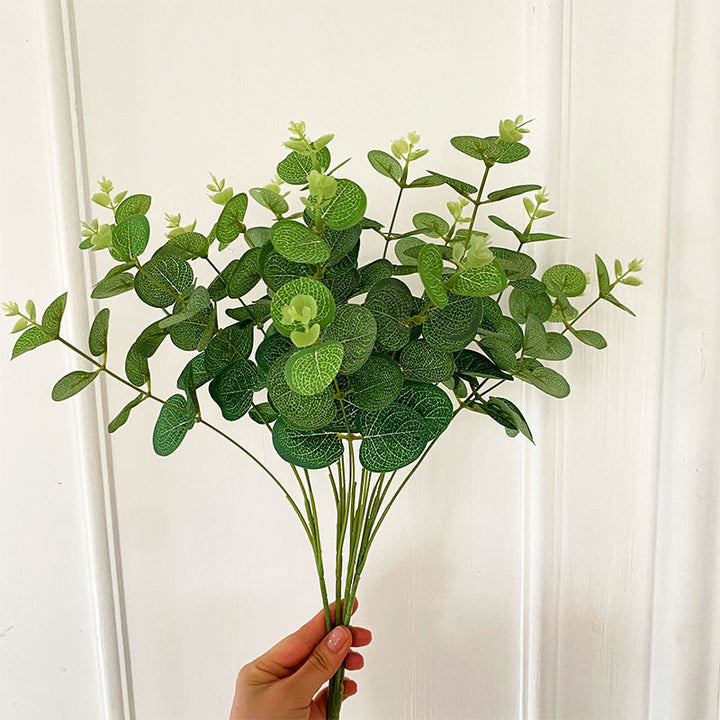 Artificial flowering branch with lifelike leaves and delicate flowers