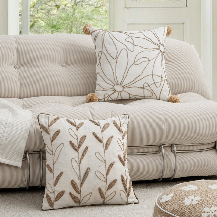 Decorative linen cushion with hand-stitched jute application