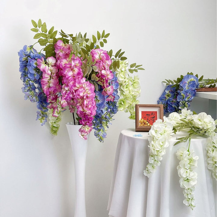 Artificial flower branch with lifelike, hanging flowers