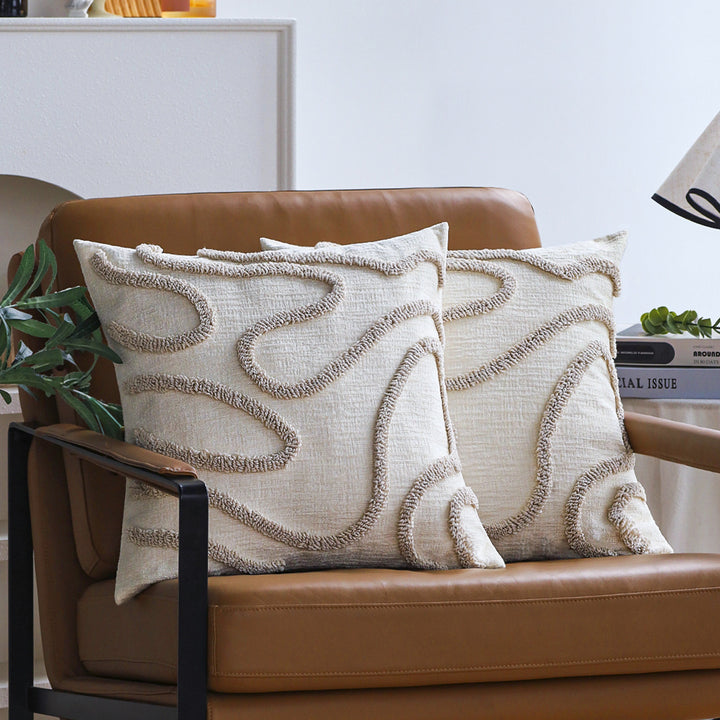 Square decorative cushion cover with hand-tufted loop appliqué and fine linen look