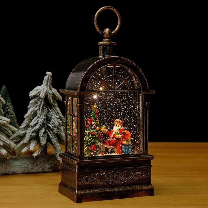 Nostalgic Christmas lantern with snowfall and moving Santa Claus scene