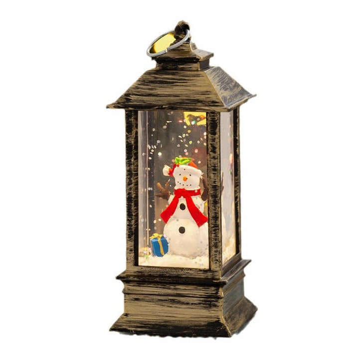 Christmas lantern with LED lighting and decorative snow effect
