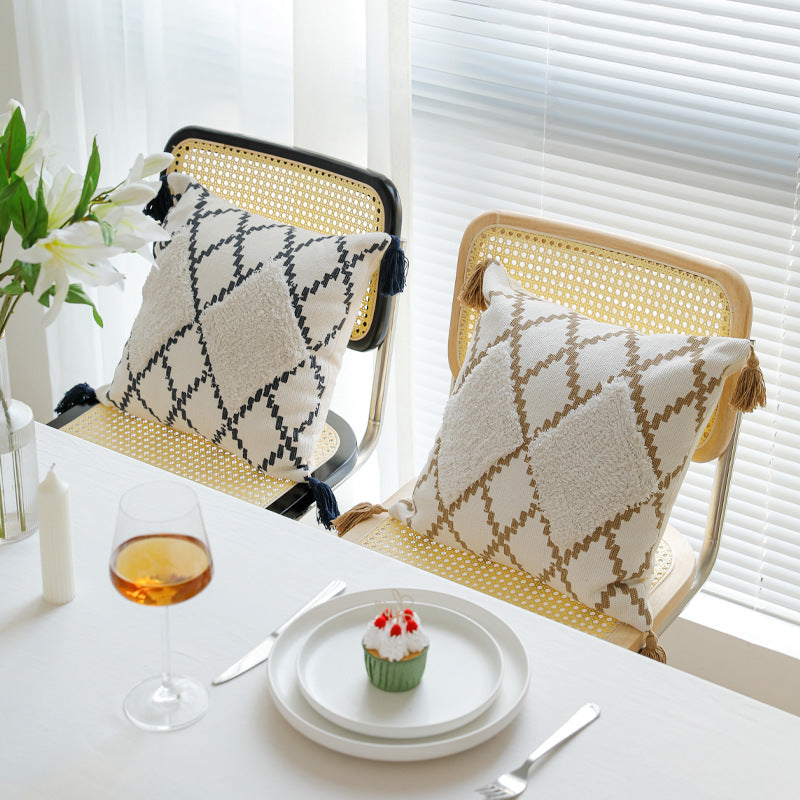 Decorative Boho cushion cover with hand-tufted diamond relief, tassels, and woven cotton blend