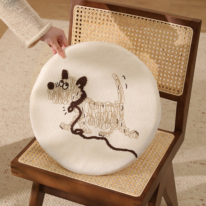 Round padded seat cushion with embroidered cat motif