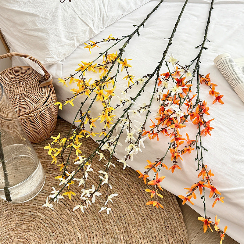 Artificial flower branch with intricately detailed yellow flowers