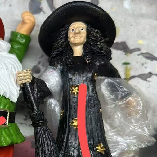 Decorative witch figure with broom