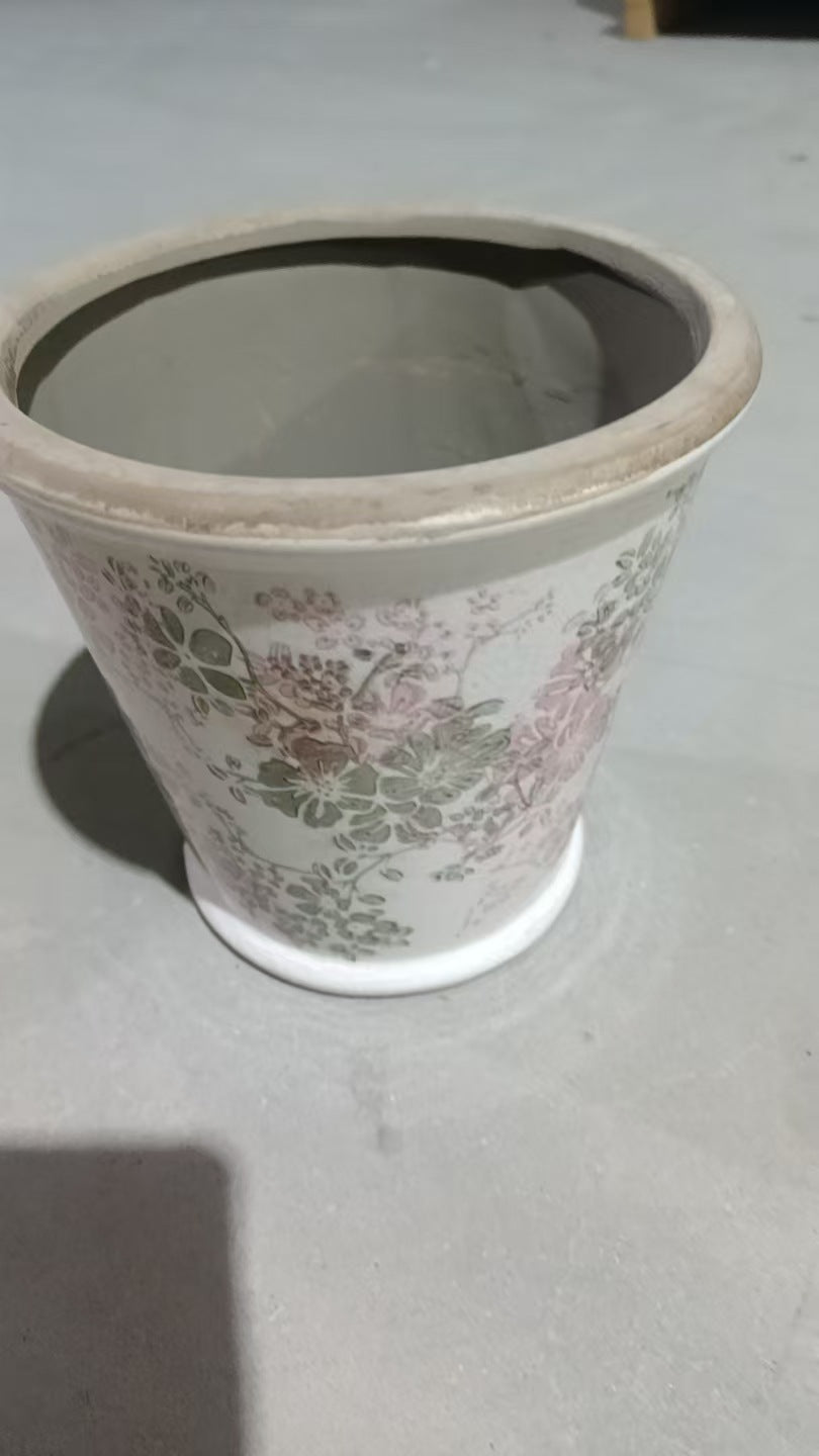 Decorative ceramic flower pot with floral design