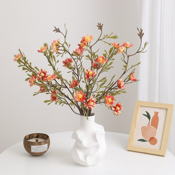 Elegant artificial flower branch with detail-loving blossoms